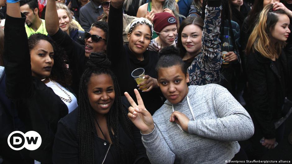 A person holding up their fist in protest during an anti-racism demonstration in Frankfurt, Germany