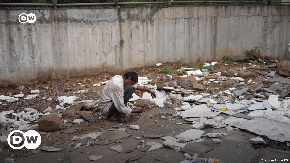 Ukrainian servicemen ride a tank on a road near the village of Robotyne