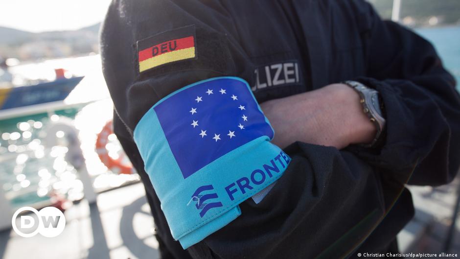 Two Greek officers patrol the Greek-Turkish border