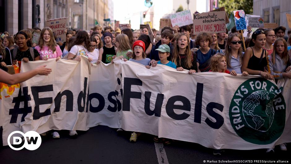 Migrants gather in the harbour of Italian island of Lampedusa