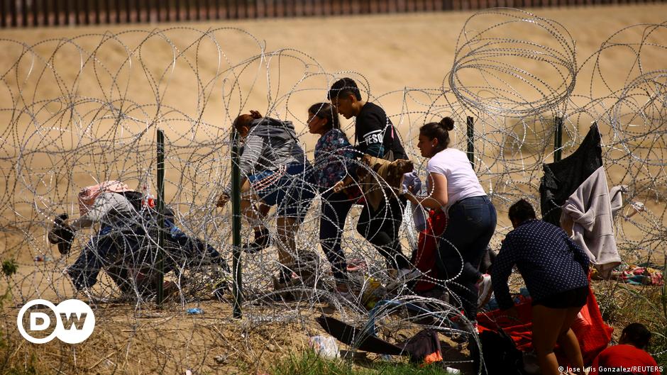 Refugees from Nagorno-Karabakh region sit in the back of a truck upon arrival in the border village of Kornidzor, Armenia