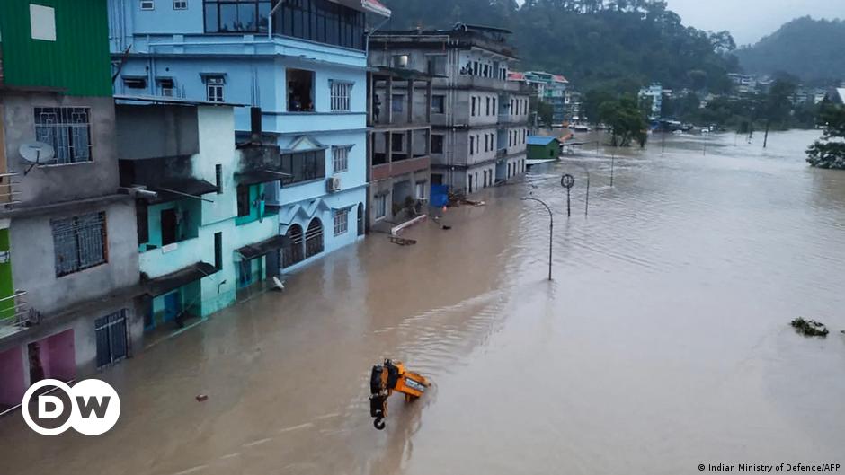 An aerial view of trees and a river flooding its banks in Himachal Pradesh, India