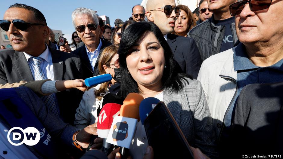An Iranian women holds up her arm at a 2022 protest