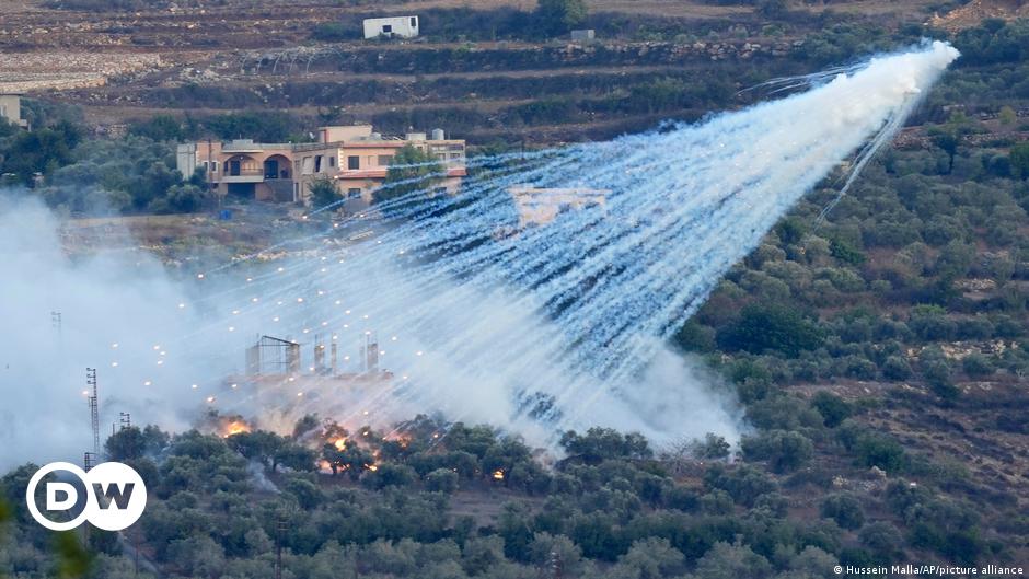 An Israeli soldier in the turret hatch of one of the Merkava battle tanks amassed near the Lebanese border in the upper Galilee in northern Israel