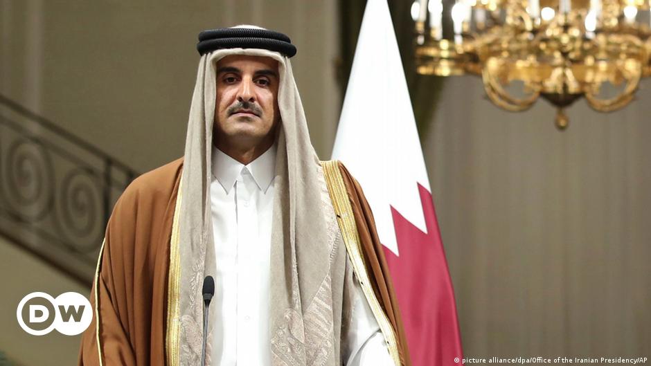 Laborers walk to the Lusail Stadium, one of the 2022 World Cup stadiums, in Lusail, Qatar