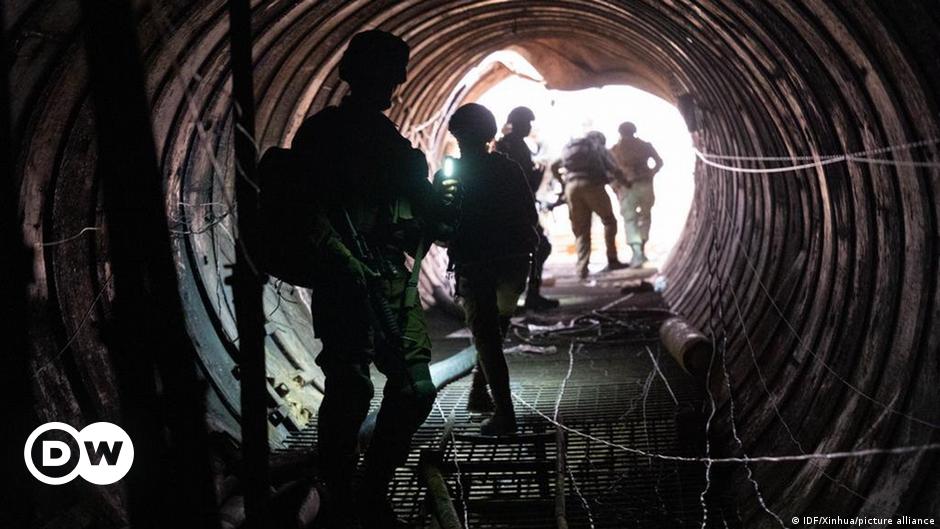 Jean-Pierre Lacroix, in glasses and coat and tie, sits in a chair and looks at the camera