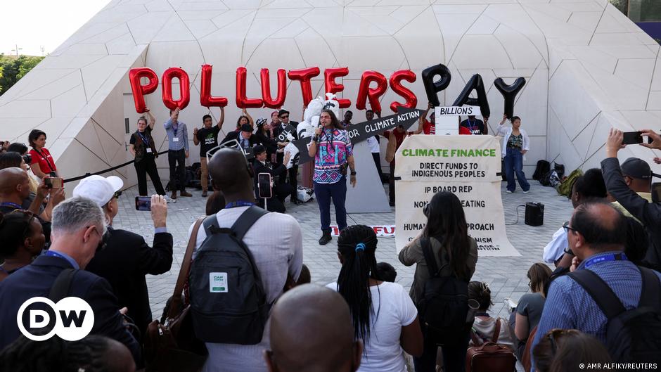 People walk at the venue of the COP28 United Nations climate summit in Dubai
