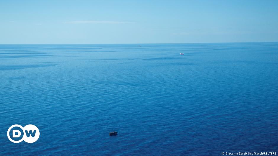 A boat called "Humanity 1" belonging to the "SOS Humanity" rescue charity, pictured at sea from another vessel.