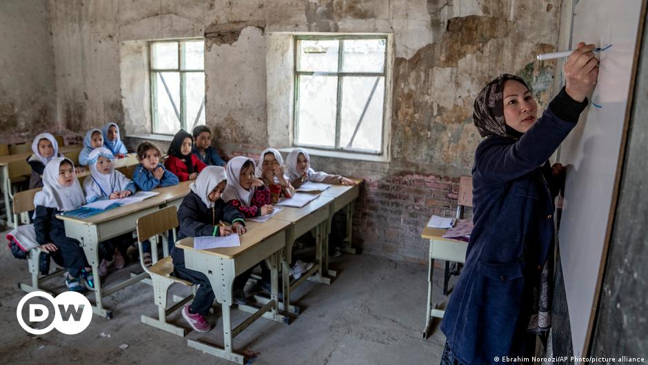 An army soldier examines damages on the site of a bombing at a police station on the outskirts of Dera Ismail Khan, Pakistan