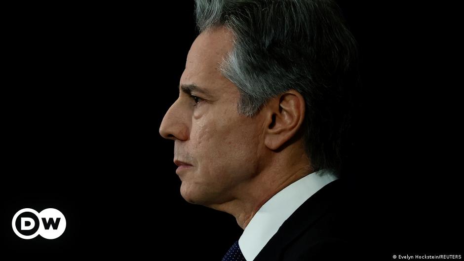 Aid workers sit in the back of a UNRWA truck