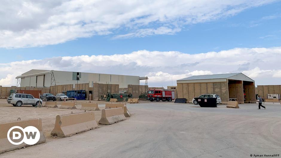 A woman walks between the walls at the Palestinian refugee camp of Burj al Barajneh in Beirut