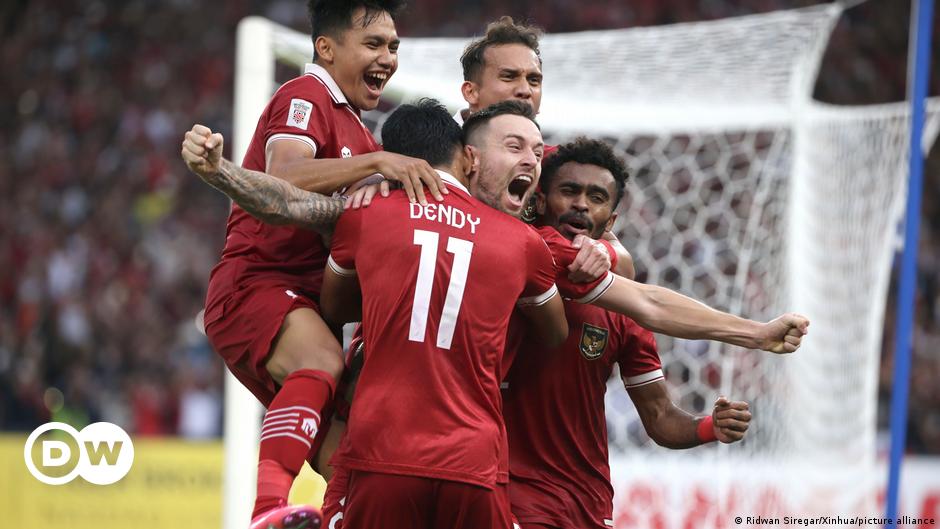 The Palestinian national team stand for the national anthem