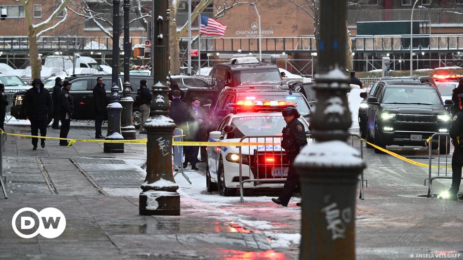 Donald Trump gestures to the crowd at a caucus night party in Des Moines