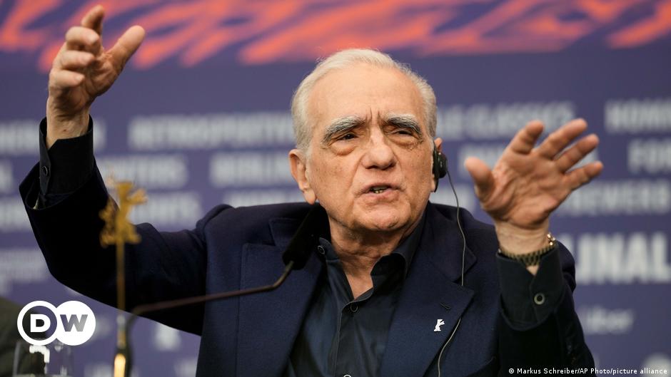 Portrait of a young woman with red hair and glasses