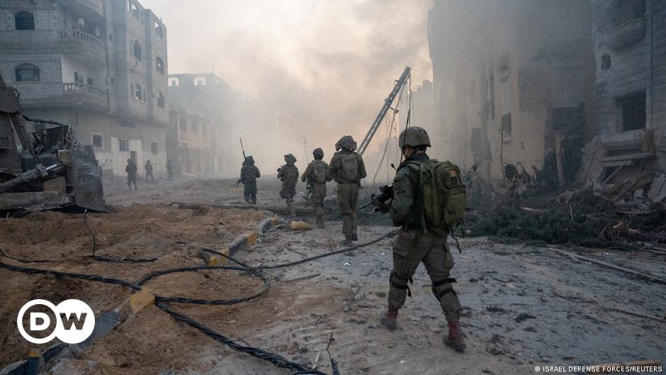 Protesters holding up pictures of Israeli hostages being held by Hamas militants rally in Tel Aviv.
