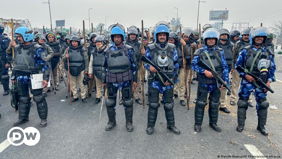 Indian Finance Minister Nirmala Sitharaman holds a red pouch before presenting the federal budget in the Parliament.