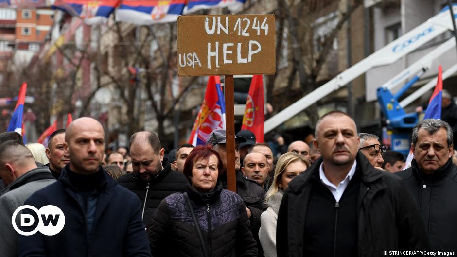 A young woman (Vjosa Cerkini) with long black hair