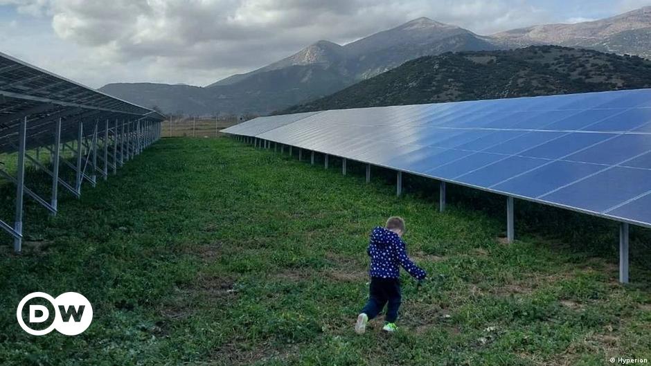 Portrait of a woman with brown hair wearing a black turtleneck sweater