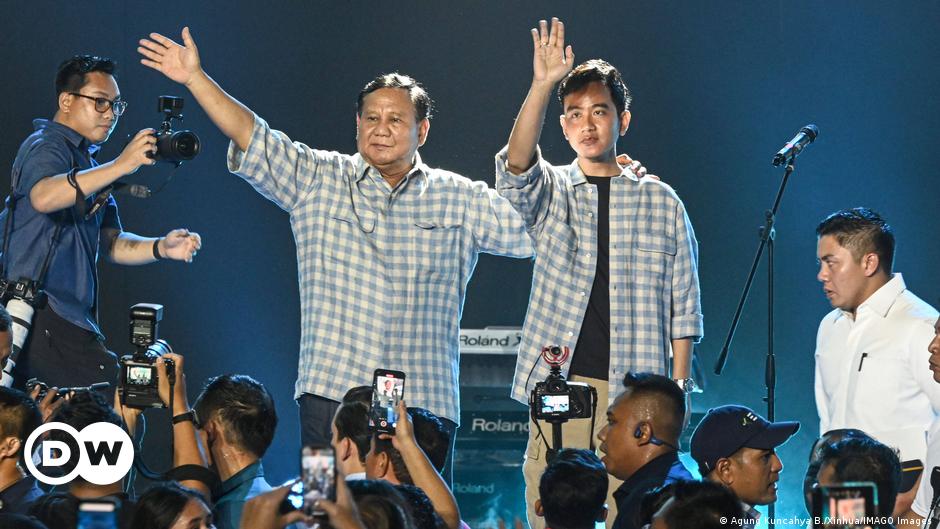 Prabowo Subianto and his running mate Gibran Rakabuming Raka greet supporters