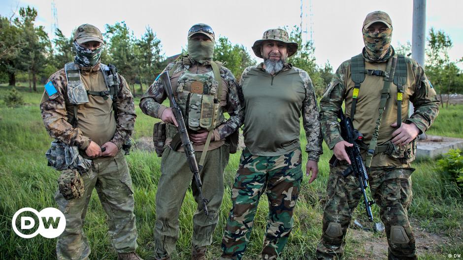 section of a road split and sloping to one side following an alleged attack on the Crimea Bridge