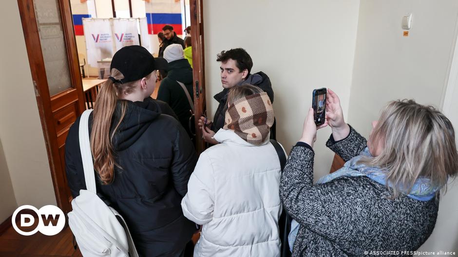 A man casts a ballot at a polling station during a presidential election in the Pacific port city of Vladivostok