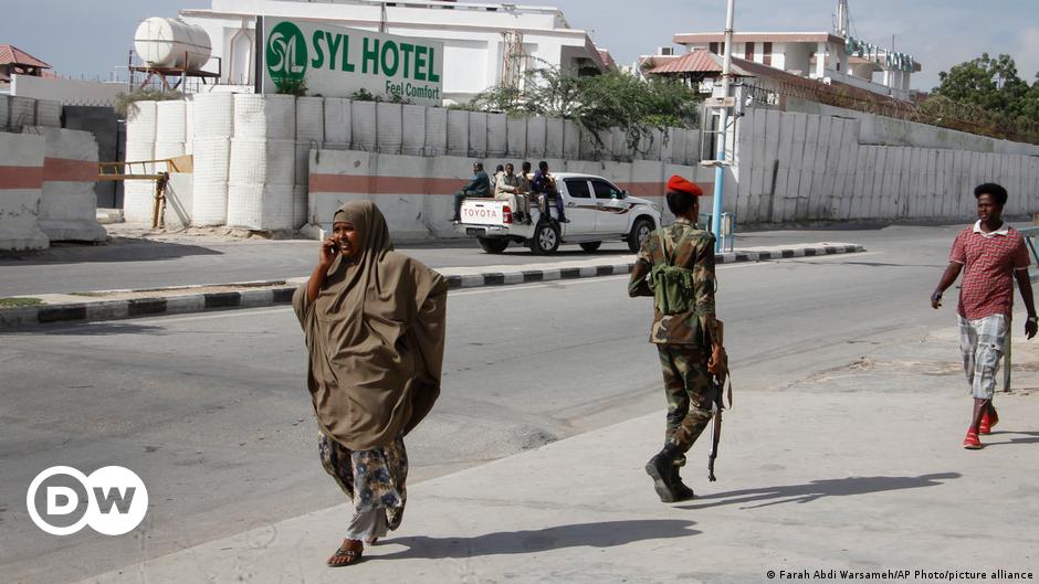 An ambulance is seen outside the perimeter of a rescue operations in Mogadishu on June 9, 2023 during an attack.